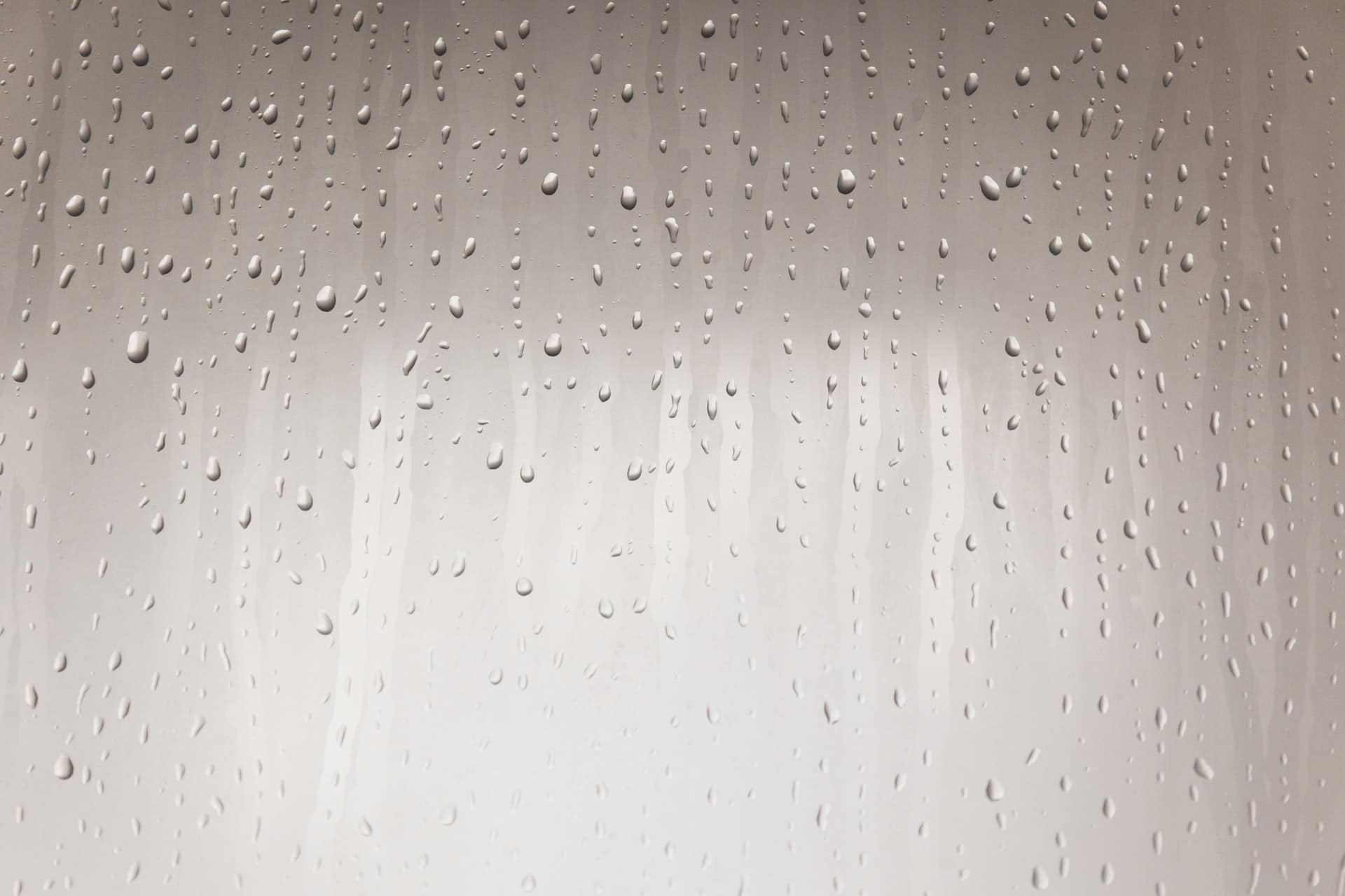 water condensation on glass shower door