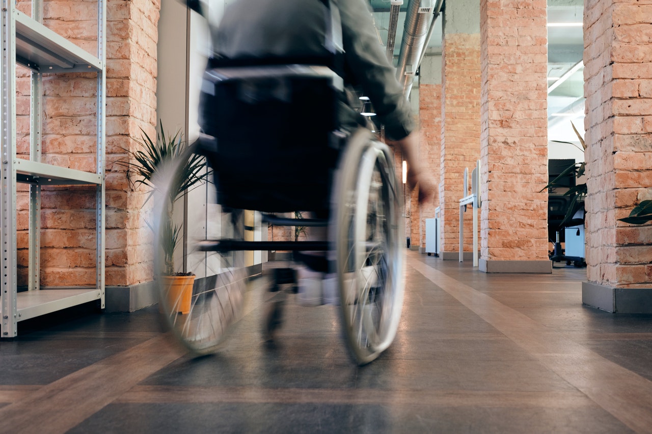 person in wheelchair in an office setting