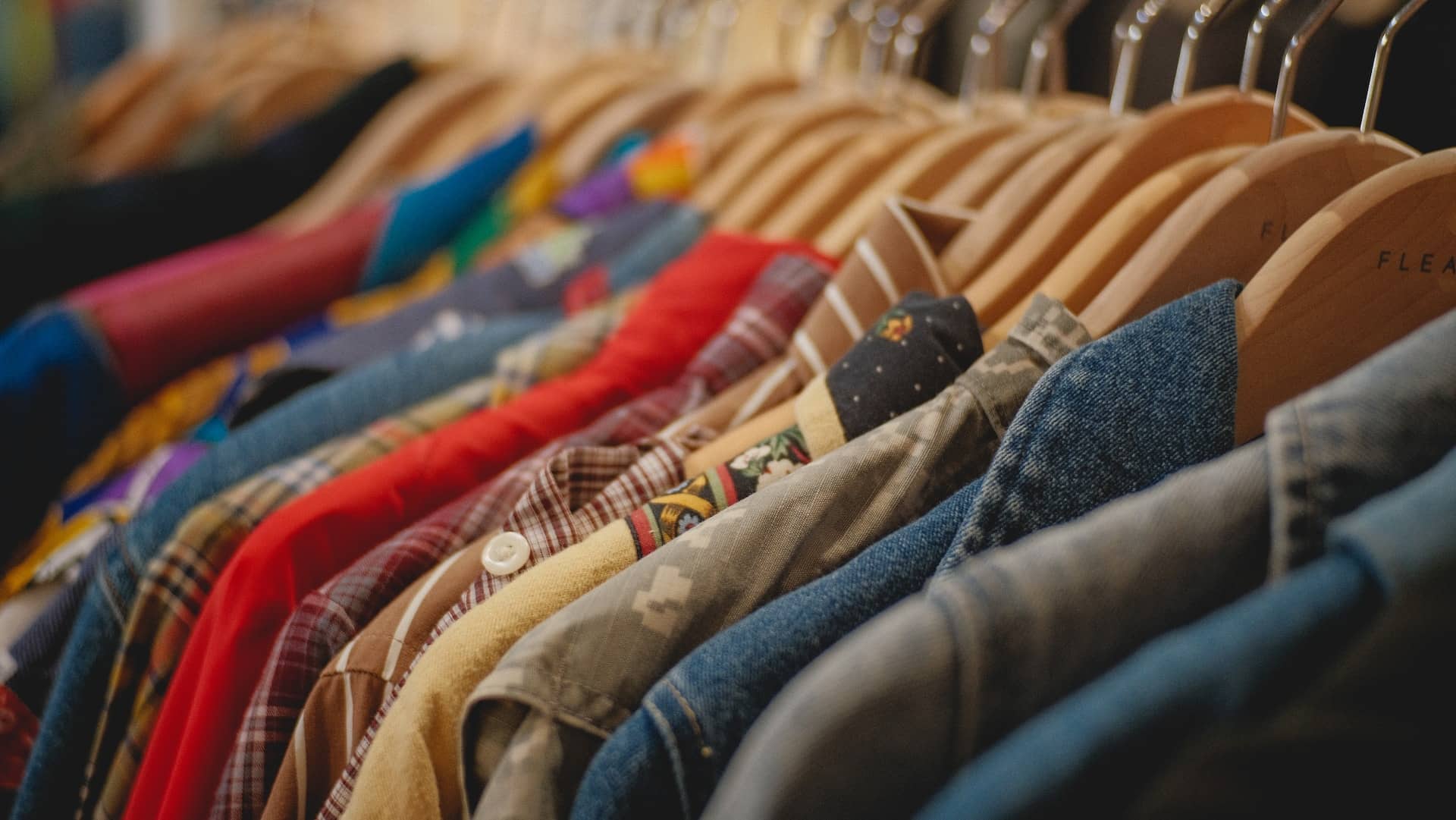 rack of button up shirts