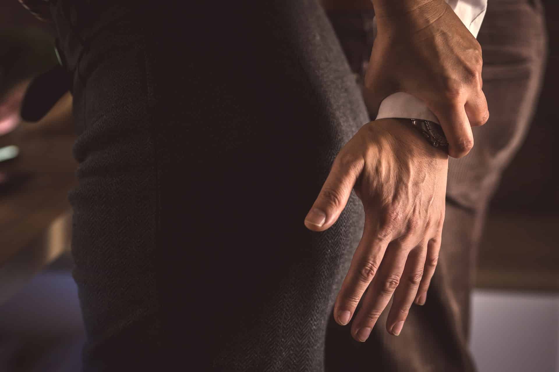 a man holding a woman's wrist