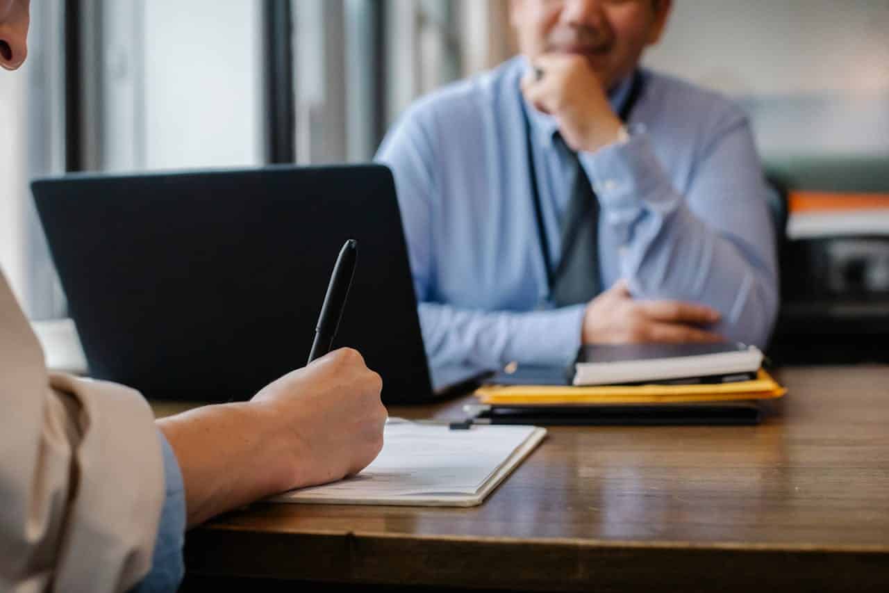 woman filling out paper work