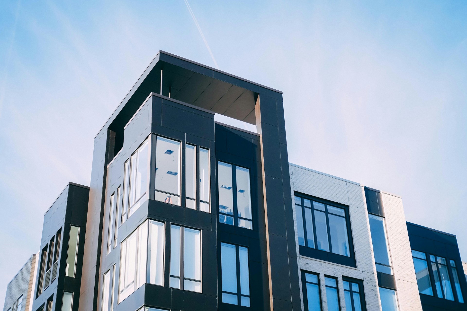 Black and white concrete low building, representing a condo company and wrongful dismissal.